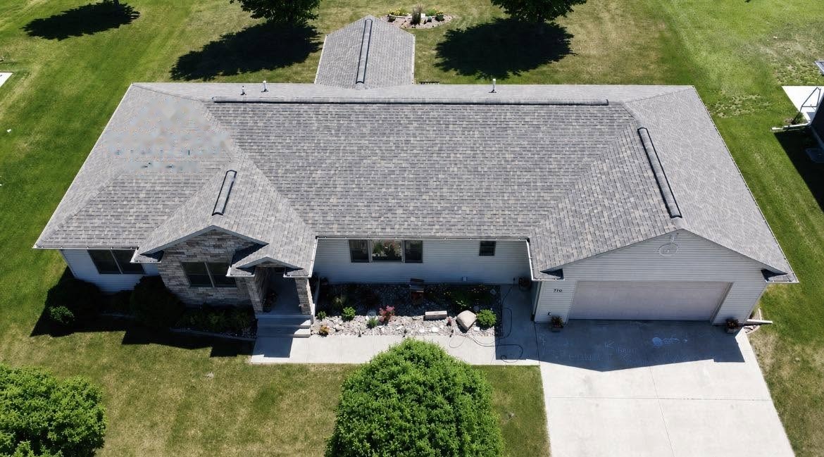Aerial view of a finished Robertson Roofing shingle roof project