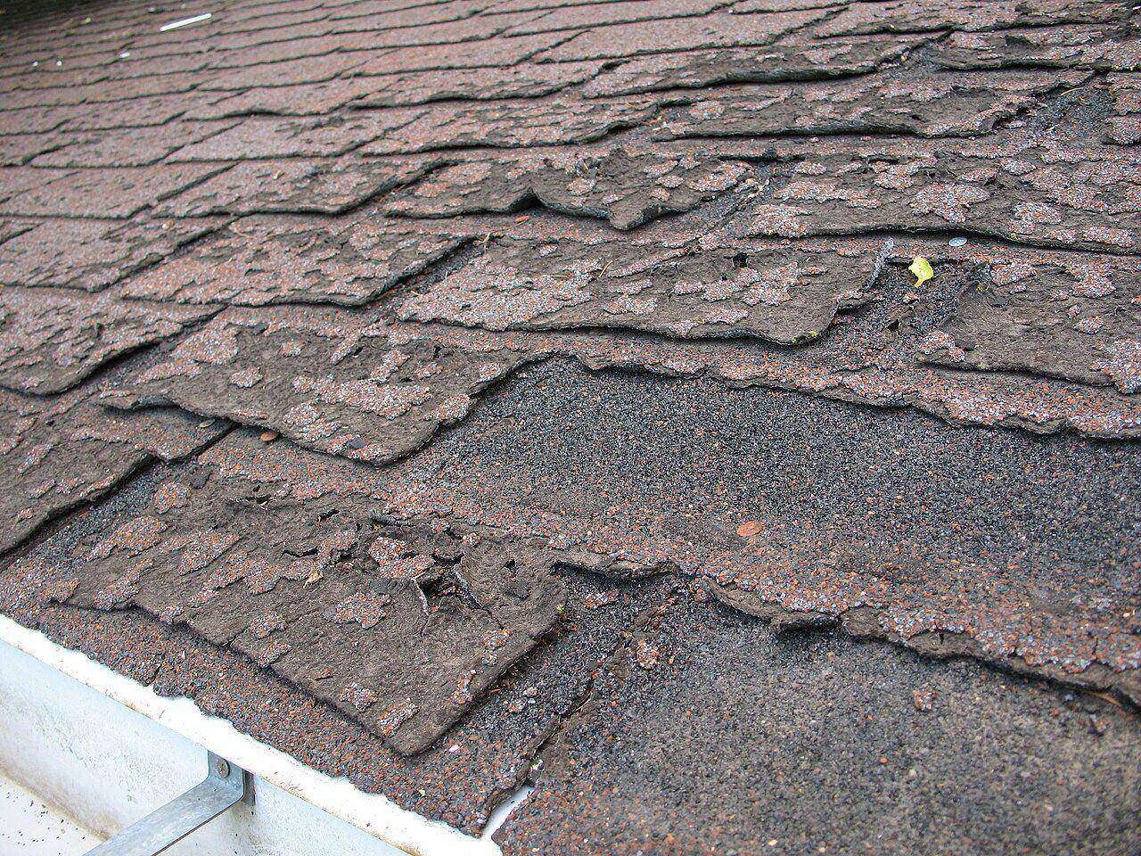 Photo of curled and failing asphalt shingles