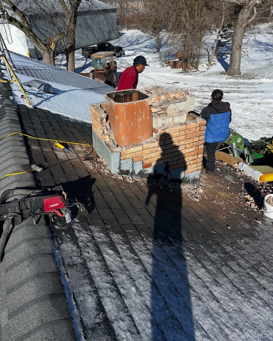 Chimney flashing repair on shingle roof